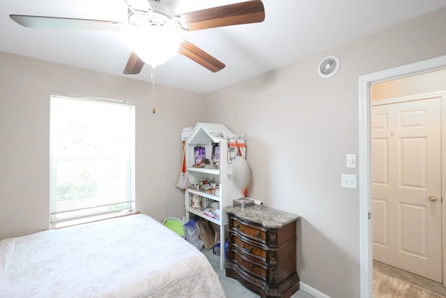 bedroom with ceiling fan and light colored carpet