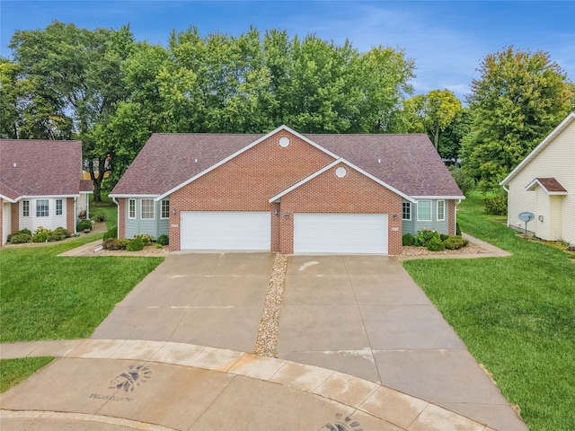 view of front facade with a garage and a front yard