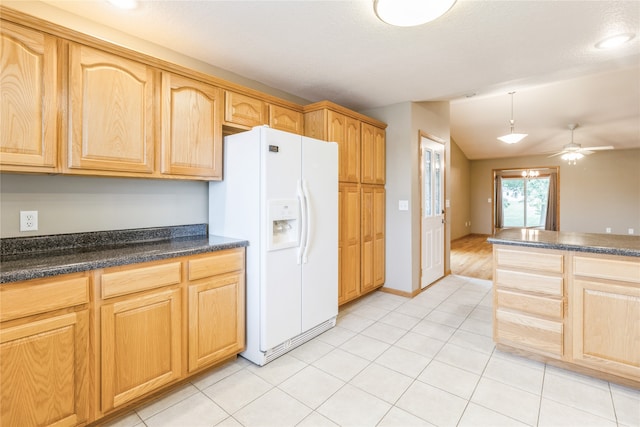 kitchen with ceiling fan, lofted ceiling, light tile patterned floors, decorative light fixtures, and white refrigerator with ice dispenser