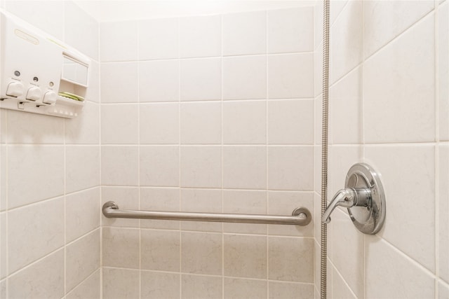 bathroom with a tile shower