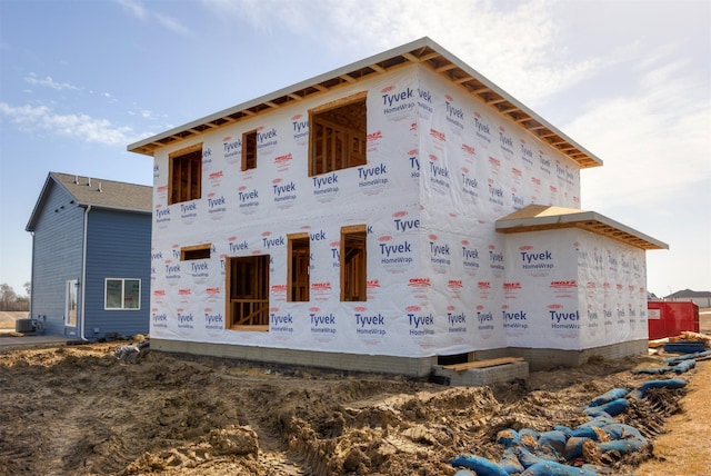 view of front of home featuring cooling unit