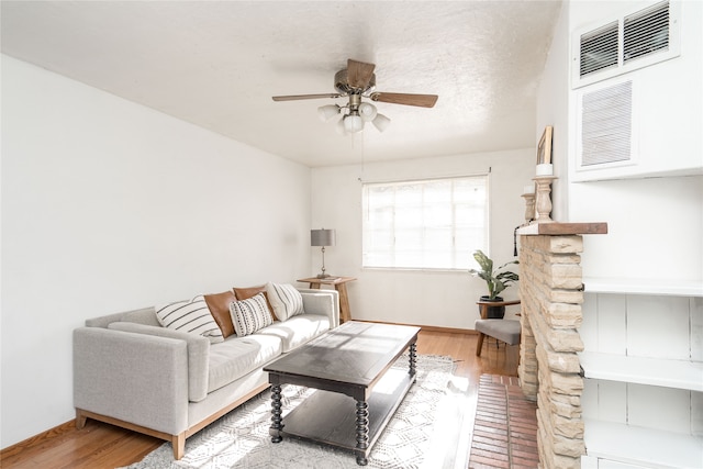 living room with ceiling fan and hardwood / wood-style flooring