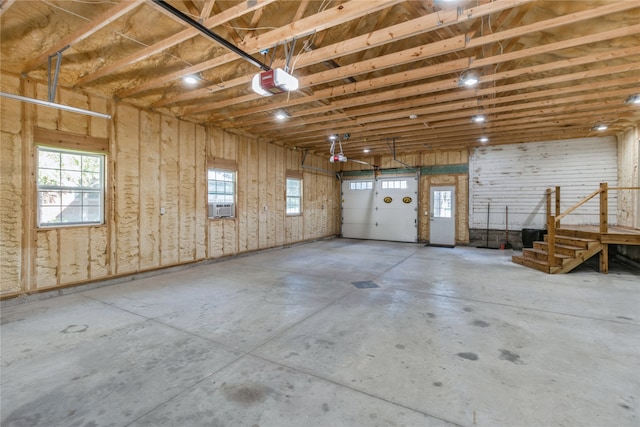 garage featuring a garage door opener and cooling unit