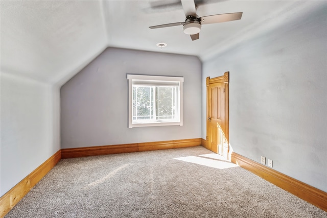 additional living space featuring lofted ceiling, ceiling fan, and light colored carpet