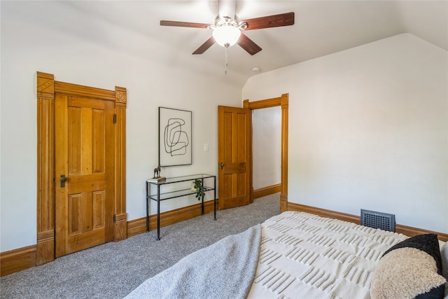 carpeted bedroom featuring ceiling fan and lofted ceiling