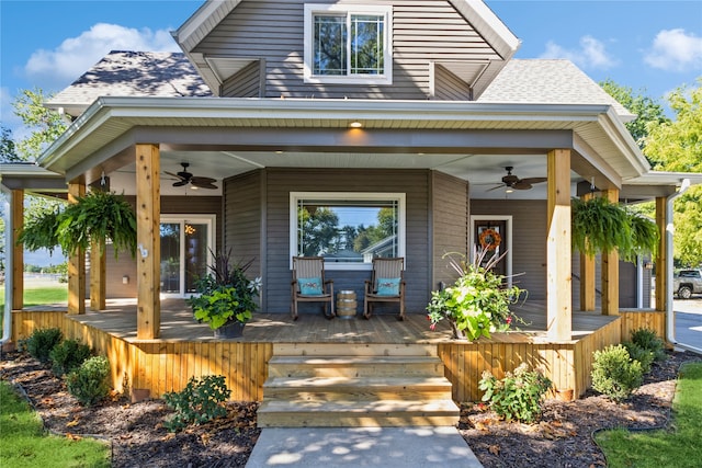 view of exterior entry with ceiling fan