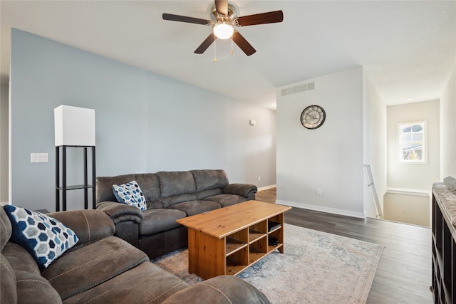 living room with ceiling fan and hardwood / wood-style flooring