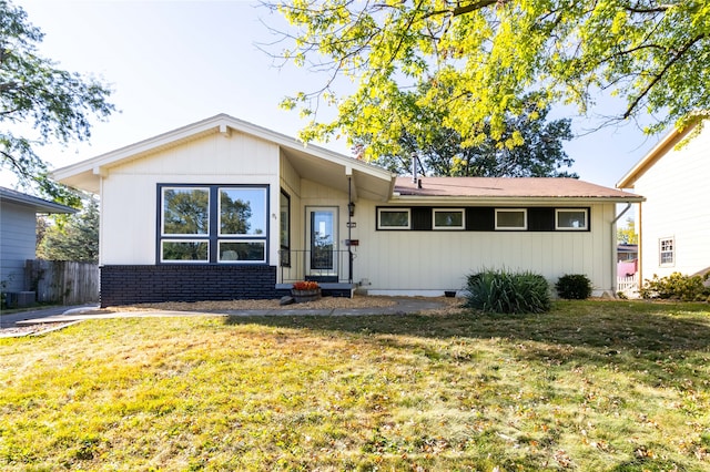 single story home with a front lawn and central AC