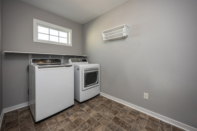 clothes washing area featuring independent washer and dryer