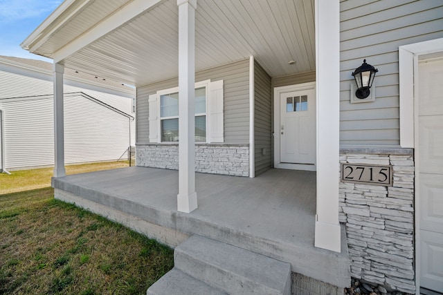 view of patio / terrace featuring covered porch and a carport