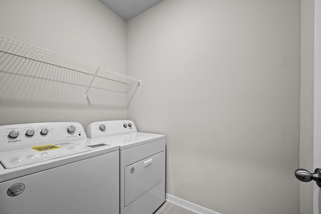 washroom with washing machine and dryer