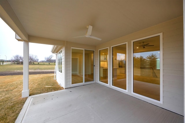 view of patio featuring ceiling fan