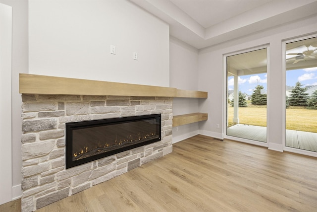 unfurnished living room with a fireplace and hardwood / wood-style floors