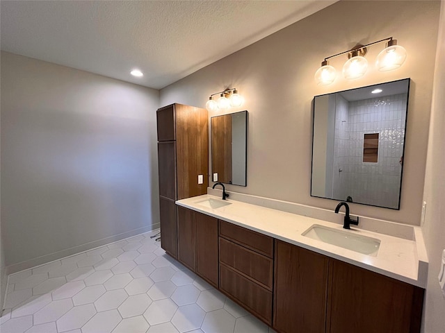 bathroom featuring vanity and a textured ceiling