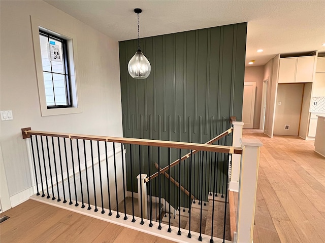 hallway with light wood-type flooring