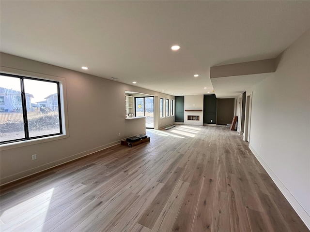 unfurnished living room with hardwood / wood-style floors