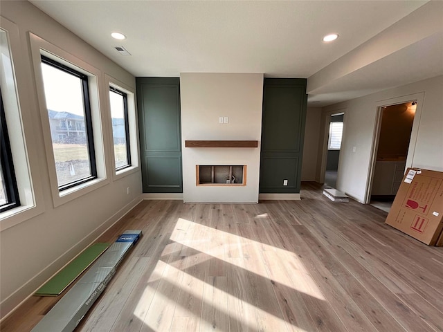 unfurnished living room featuring light hardwood / wood-style floors