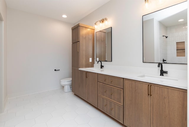 18016 Tanglewood Dr, Clive, IA 50325 - bathroom featuring double vanity, tile patterned floors, and recessed lighting
