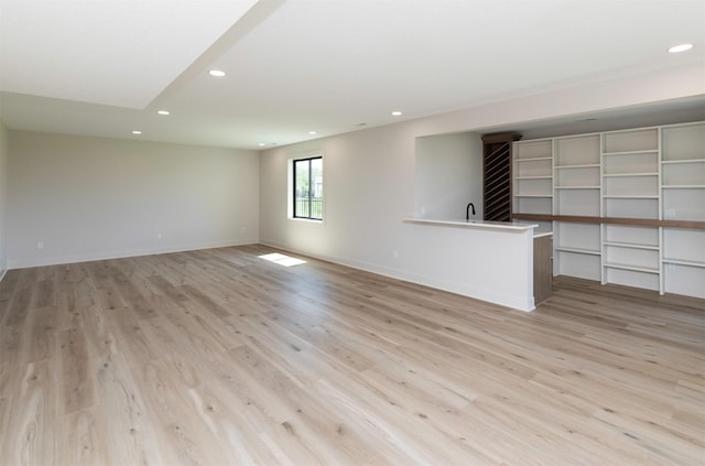 18016 Tanglewood Dr, Clive, IA 50325 - unfurnished living room with recessed lighting and light wood-style flooring