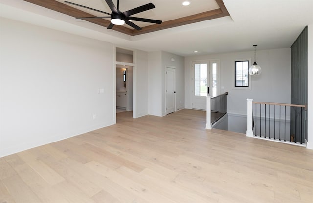 18016 Tanglewood Dr, Clive, IA 50325 - spare room with a raised ceiling, light wood-style floors, recessed lighting, and a ceiling fan