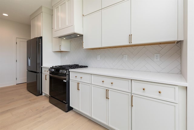 18016 Tanglewood Dr, Clive, IA 50325 - kitchen with range with gas stovetop, refrigerator with ice dispenser, light wood finished floors, light countertops, and recessed lighting