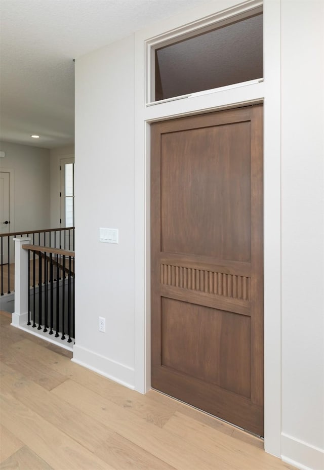 18016 Tanglewood Dr, Clive, IA 50325 - foyer featuring wood finished floors and recessed lighting