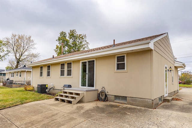 back of house with a patio area and central AC unit