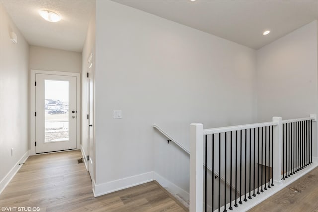 staircase with wood-type flooring