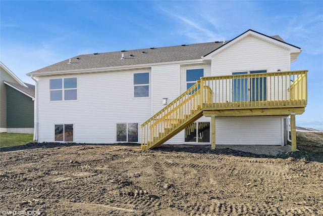 rear view of house featuring a deck