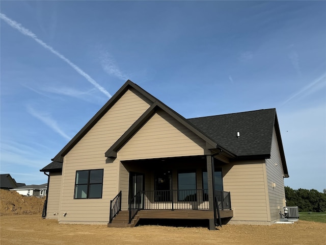 rear view of house with central air condition unit