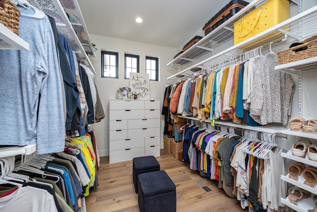 spacious closet featuring light hardwood / wood-style floors