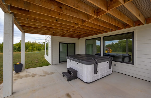 view of patio / terrace with a hot tub