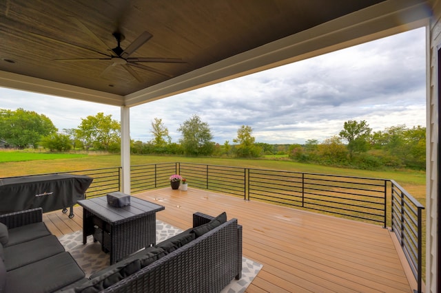 wooden deck featuring ceiling fan