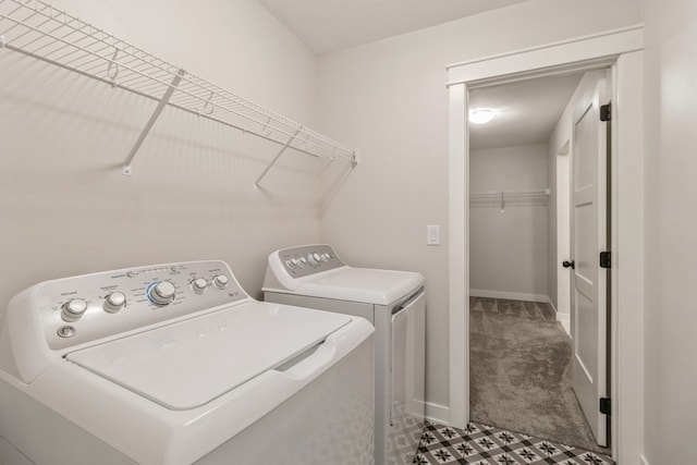 washroom featuring dark colored carpet and independent washer and dryer