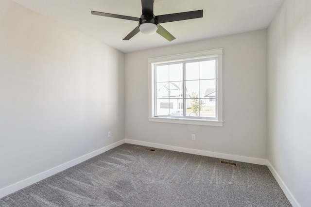 spare room featuring ceiling fan and carpet flooring