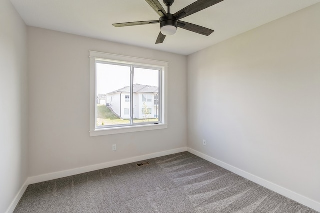 empty room featuring ceiling fan and carpet flooring