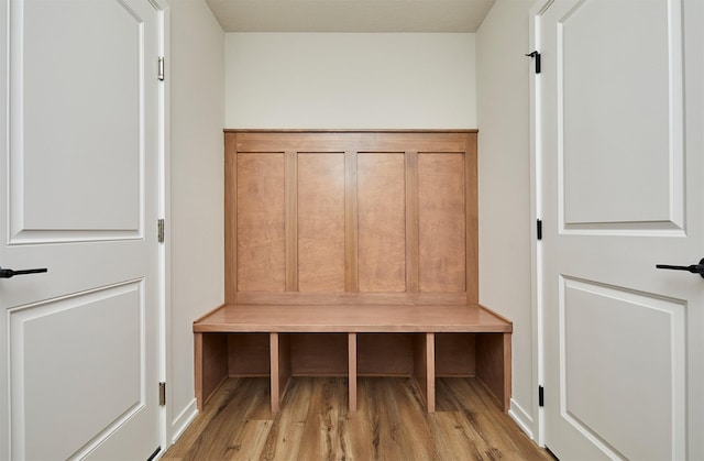 mudroom with light hardwood / wood-style floors