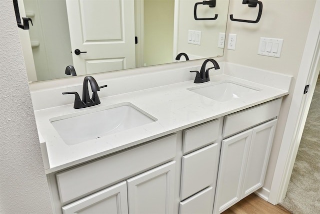 bathroom featuring vanity and hardwood / wood-style flooring