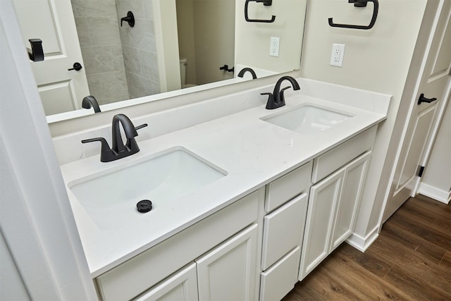 bathroom with hardwood / wood-style floors and vanity