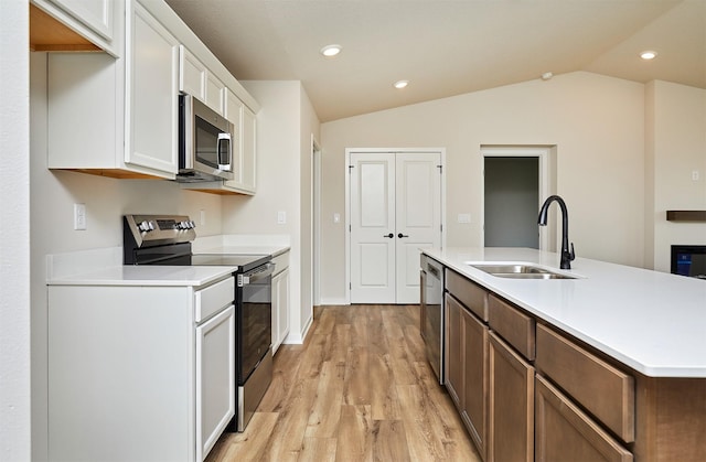 kitchen featuring white cabinetry, sink, and appliances with stainless steel finishes