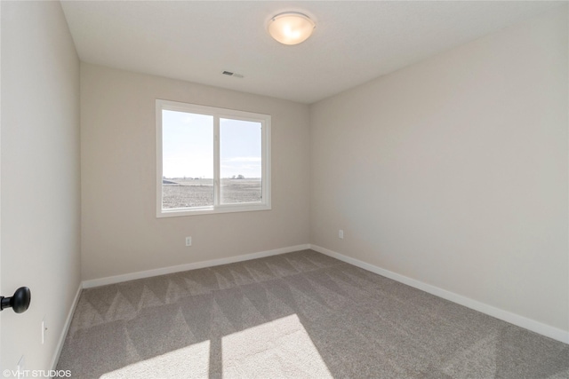 spare room featuring carpet flooring