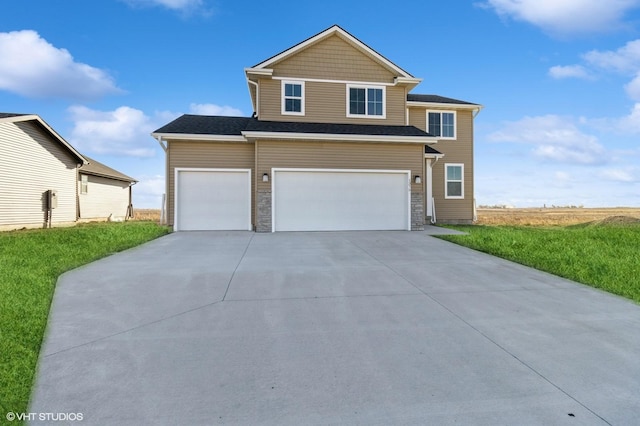 view of front of house with a garage and a front yard