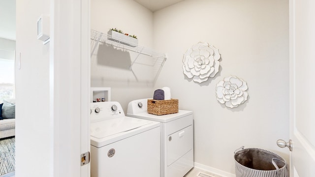 laundry area featuring independent washer and dryer