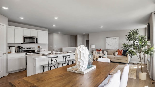 dining space featuring dark wood-type flooring