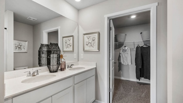 bathroom with vanity and toilet