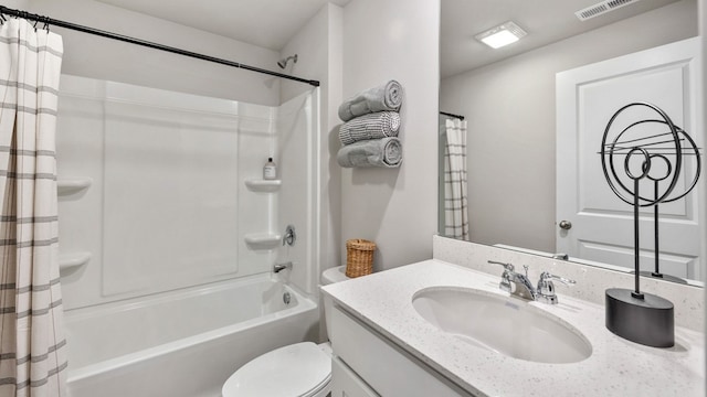 full bathroom featuring vanity, shower / bath combination with curtain, and toilet