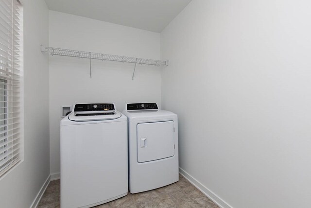 laundry room featuring washing machine and clothes dryer