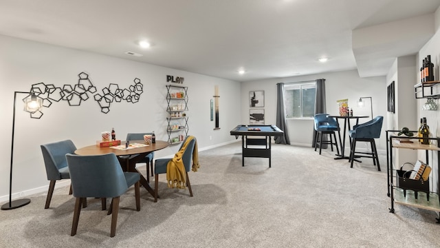 dining room featuring light carpet