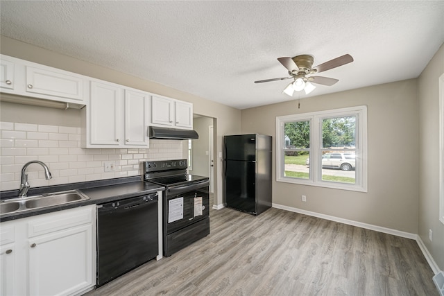 kitchen with ceiling fan, light wood-type flooring, white cabinetry, and black appliances