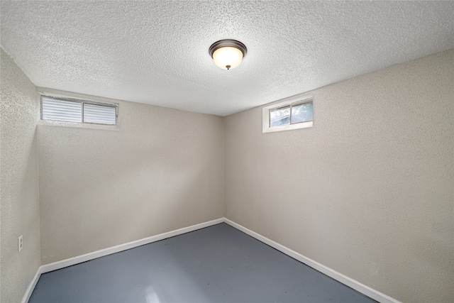 basement featuring a textured ceiling